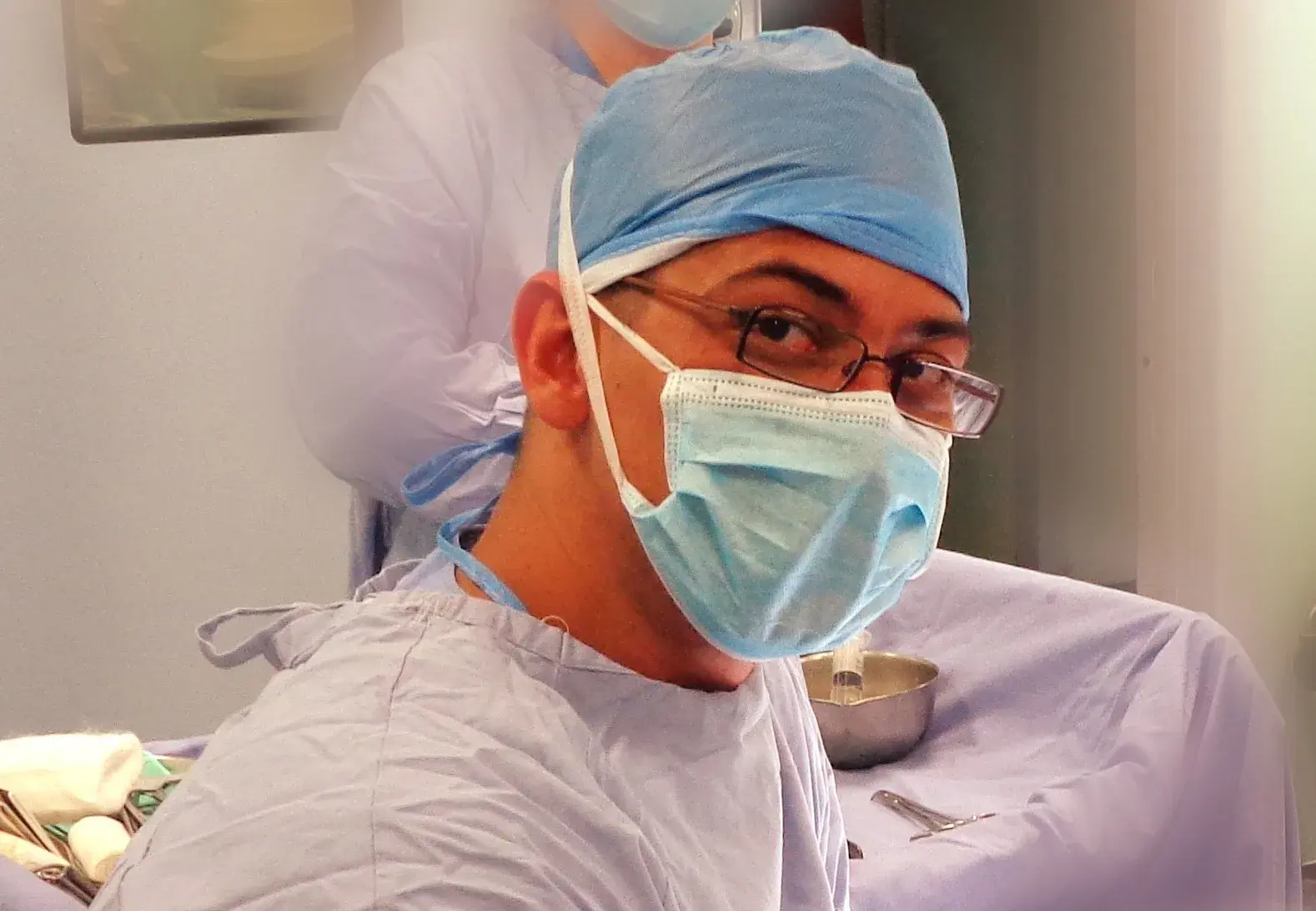 Dr Adam operating in Theatres